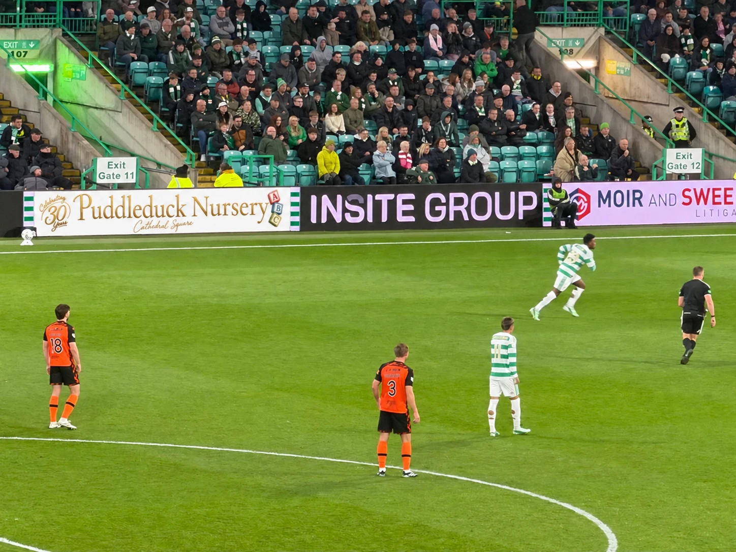 Puddleduck Nursery’s 30th anniversary advertising board beside the pitch at Celtic Park.